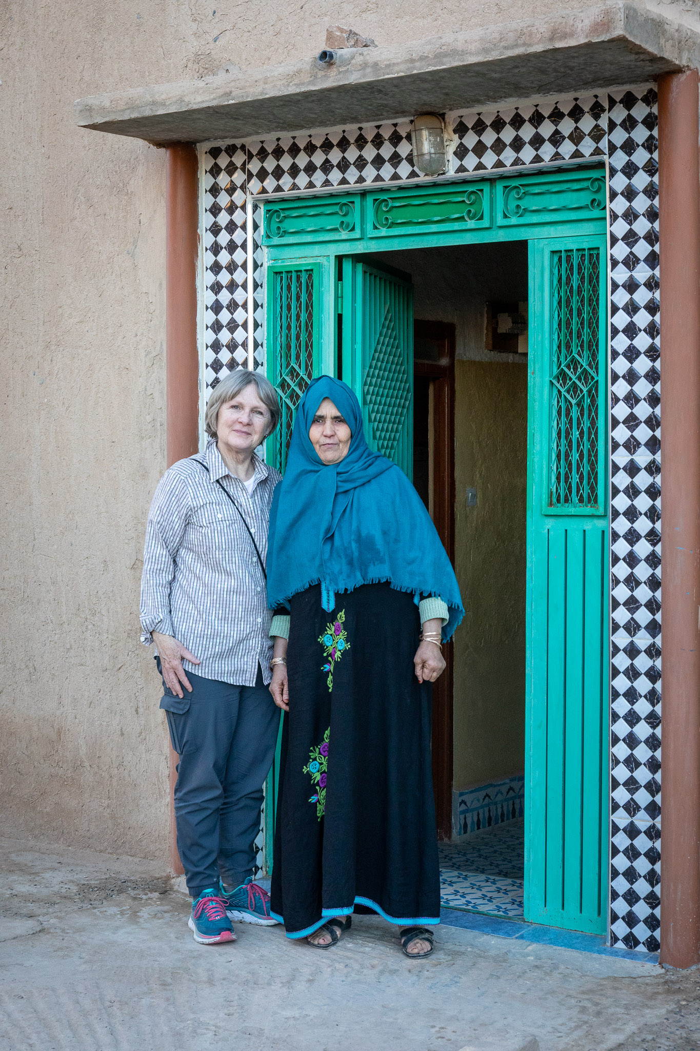 Martha & Brahim's mother at house's front door