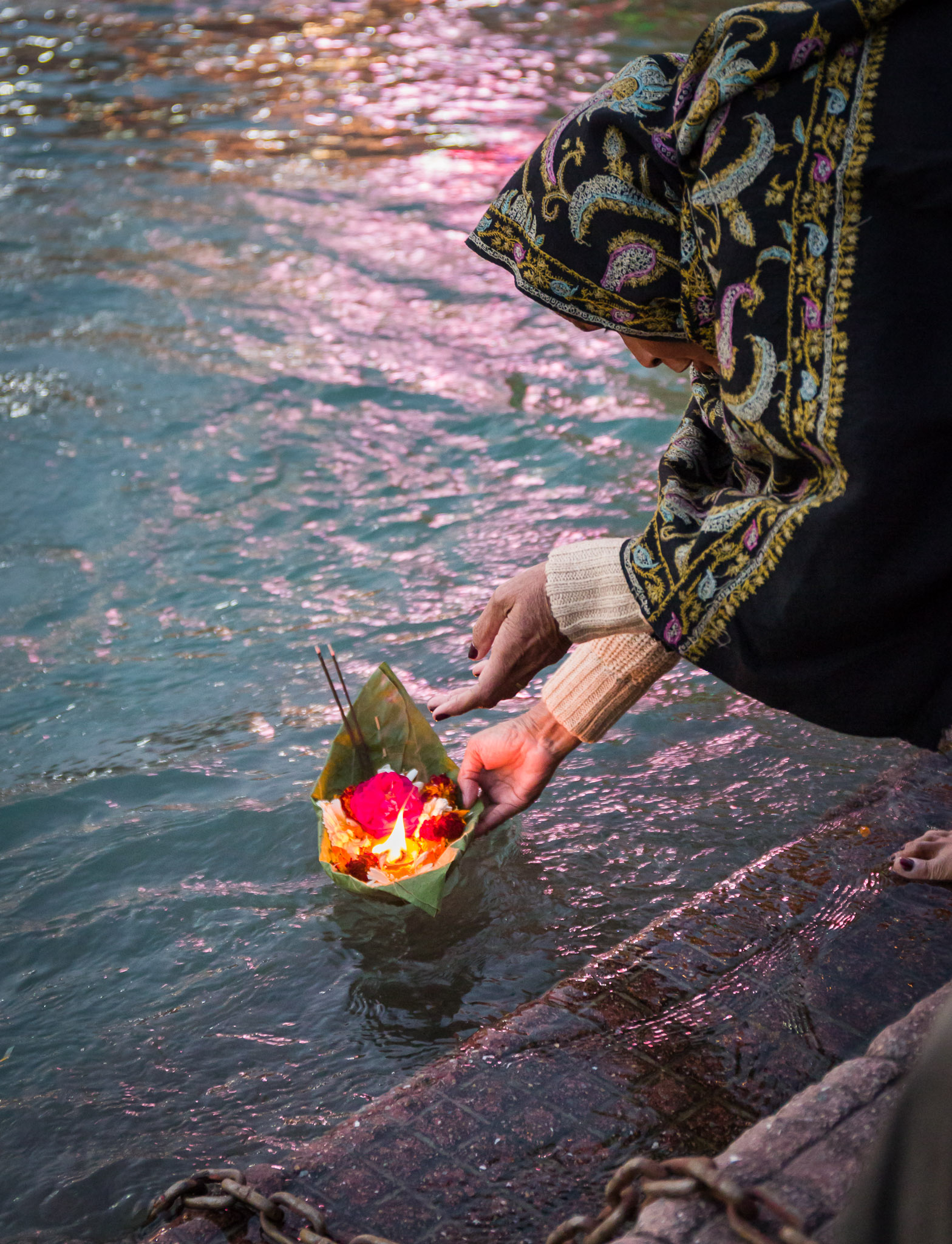 Floating a candle offering on the Ganges