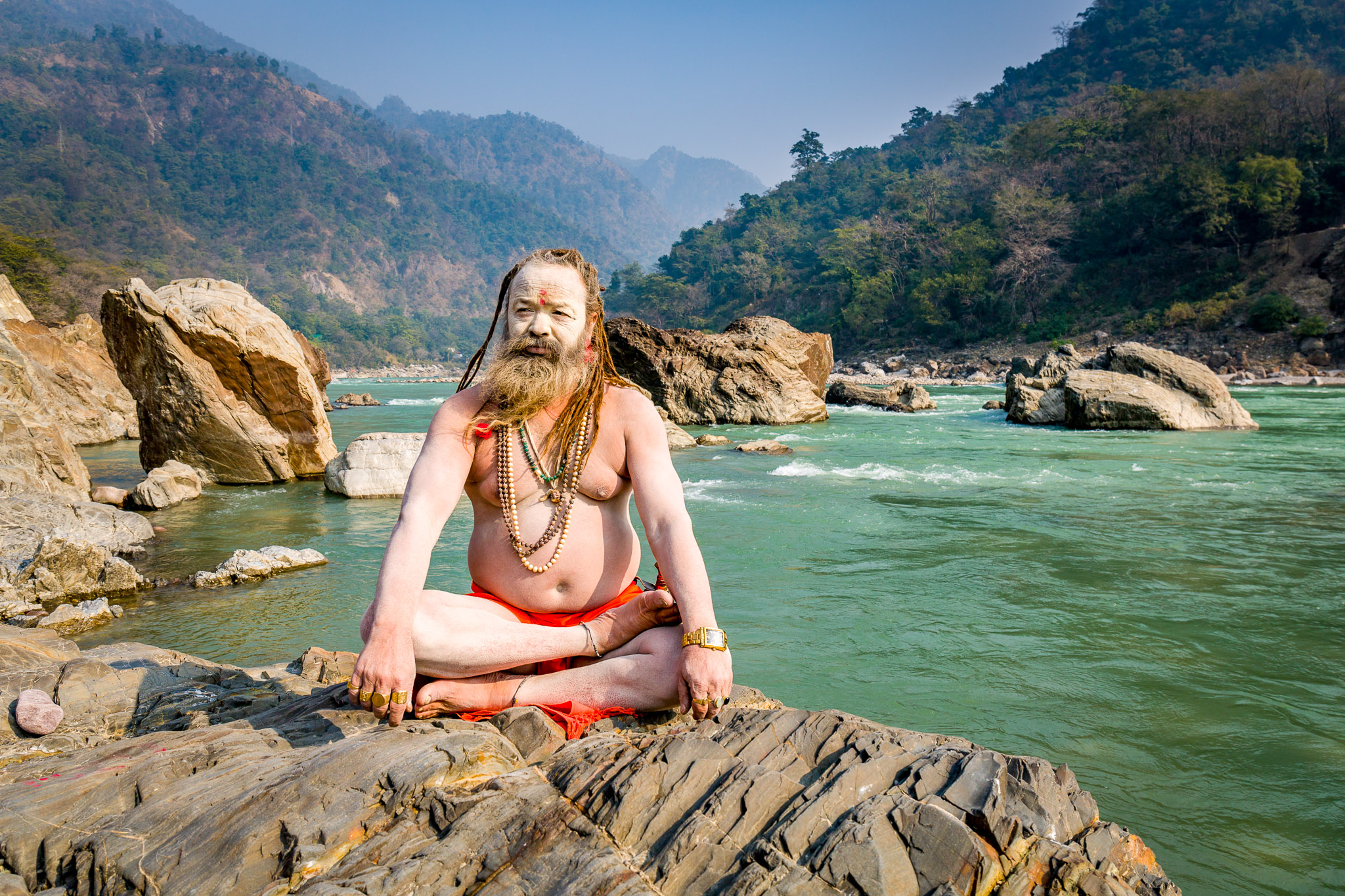 Sadhu on the Ganges emerging from the Himalaya