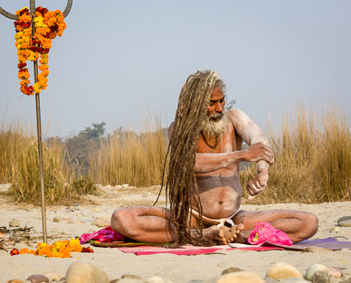 Yogi applying ash after bathing
