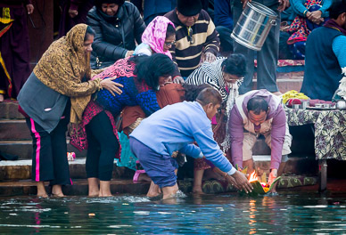 Floating a candle offering on the Ganges