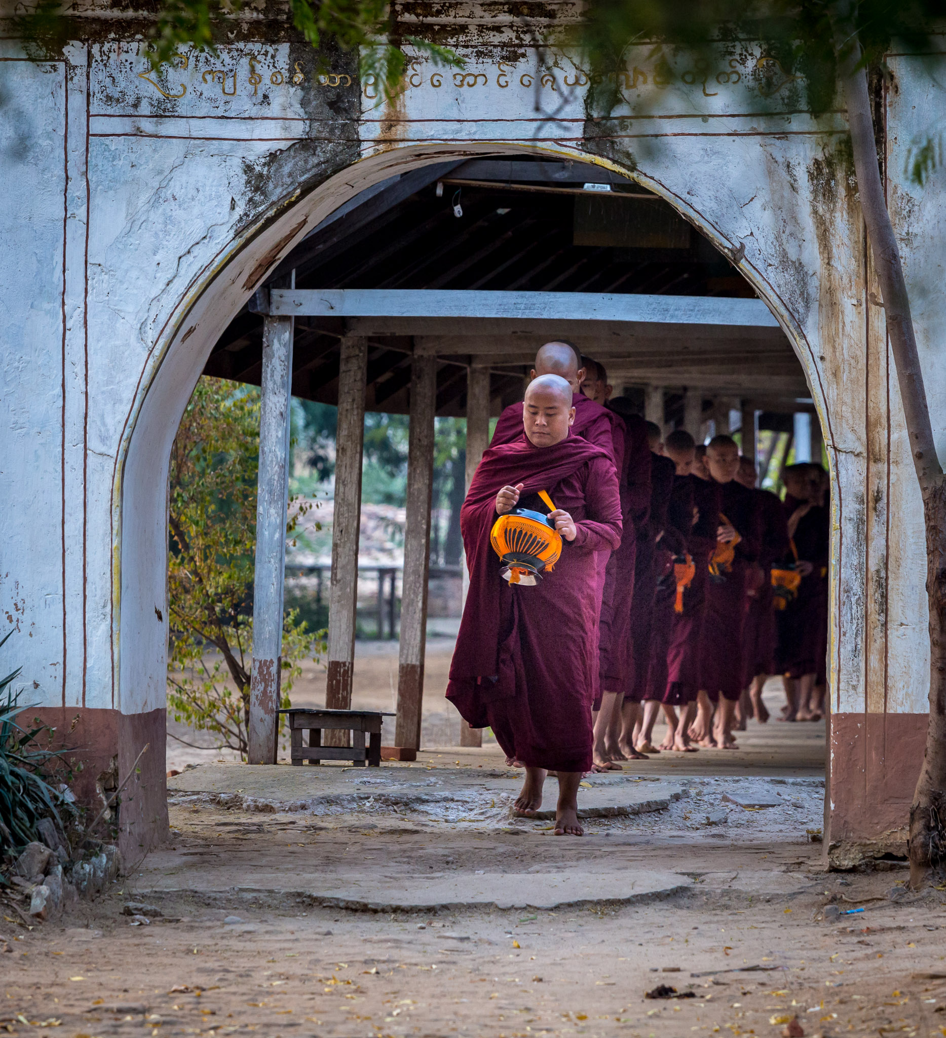 Leaving monastery for morning alms collection