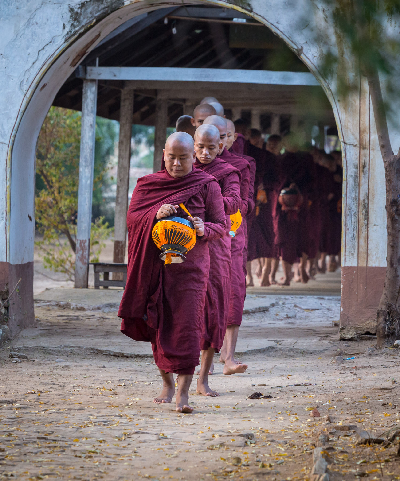 Leaving monastery for morning alms collection