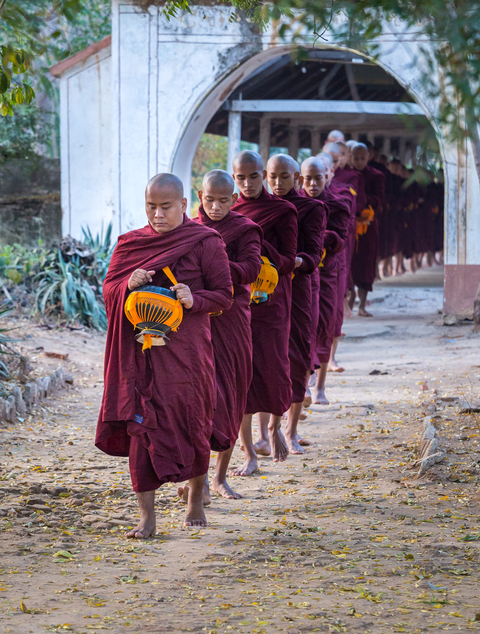 Leaving monastery for morning alms collection