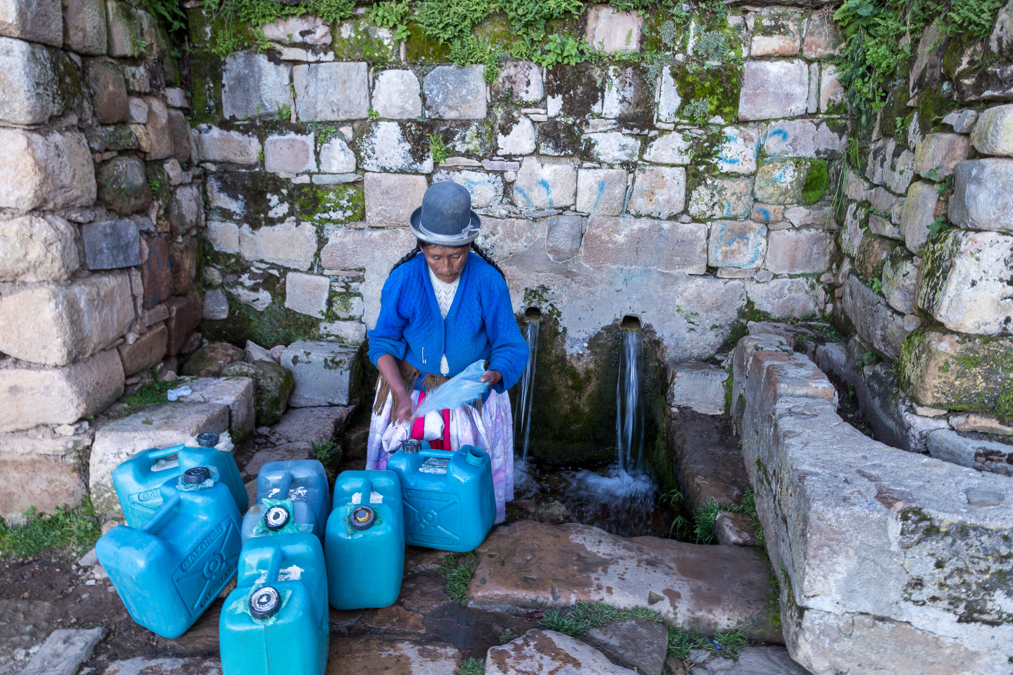 Collecting water at Yumani 's Sacred Springs, Isla del Sol