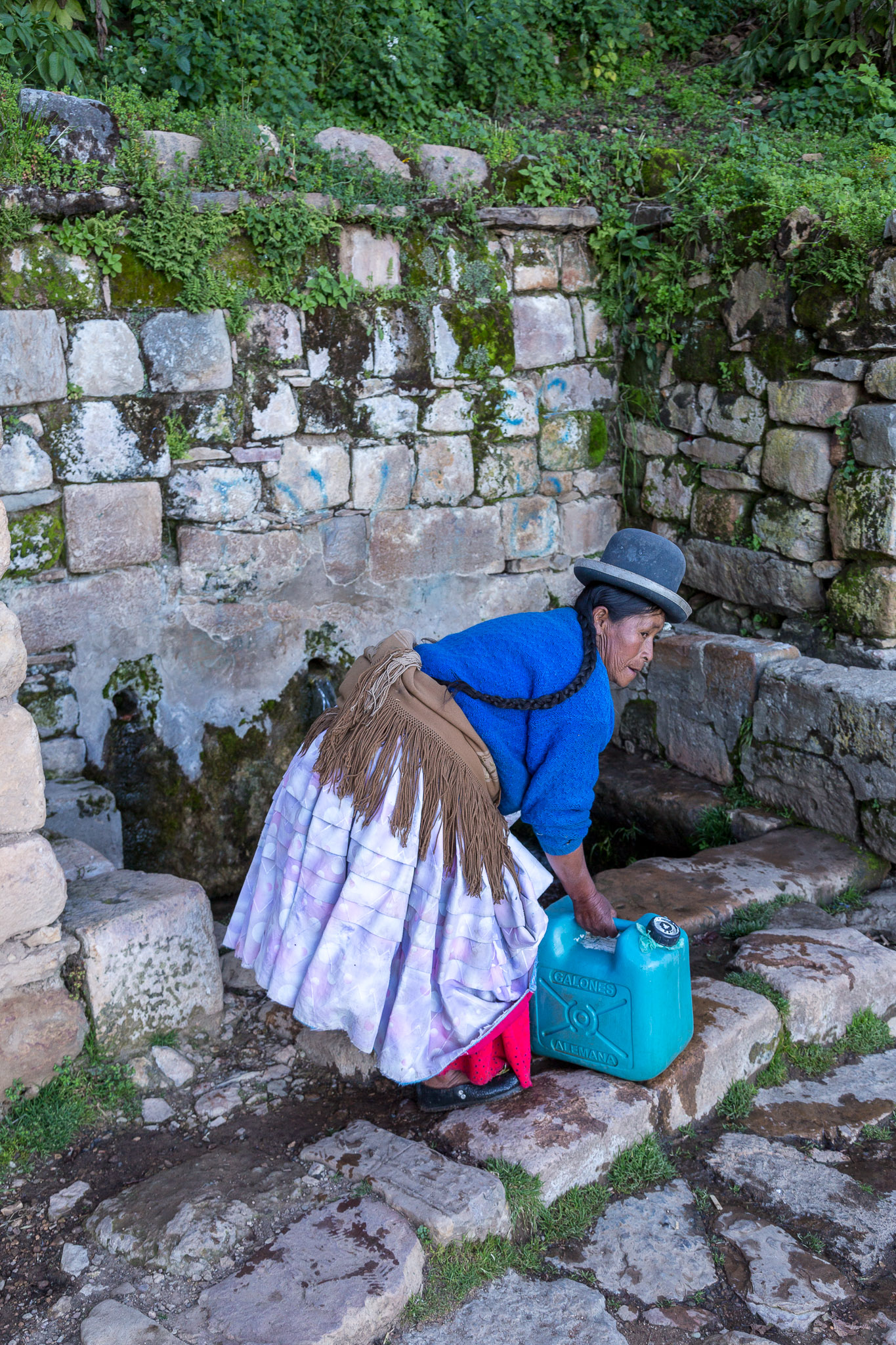 Collecting water at Yumani 's Sacred Springs, Isla del Sol