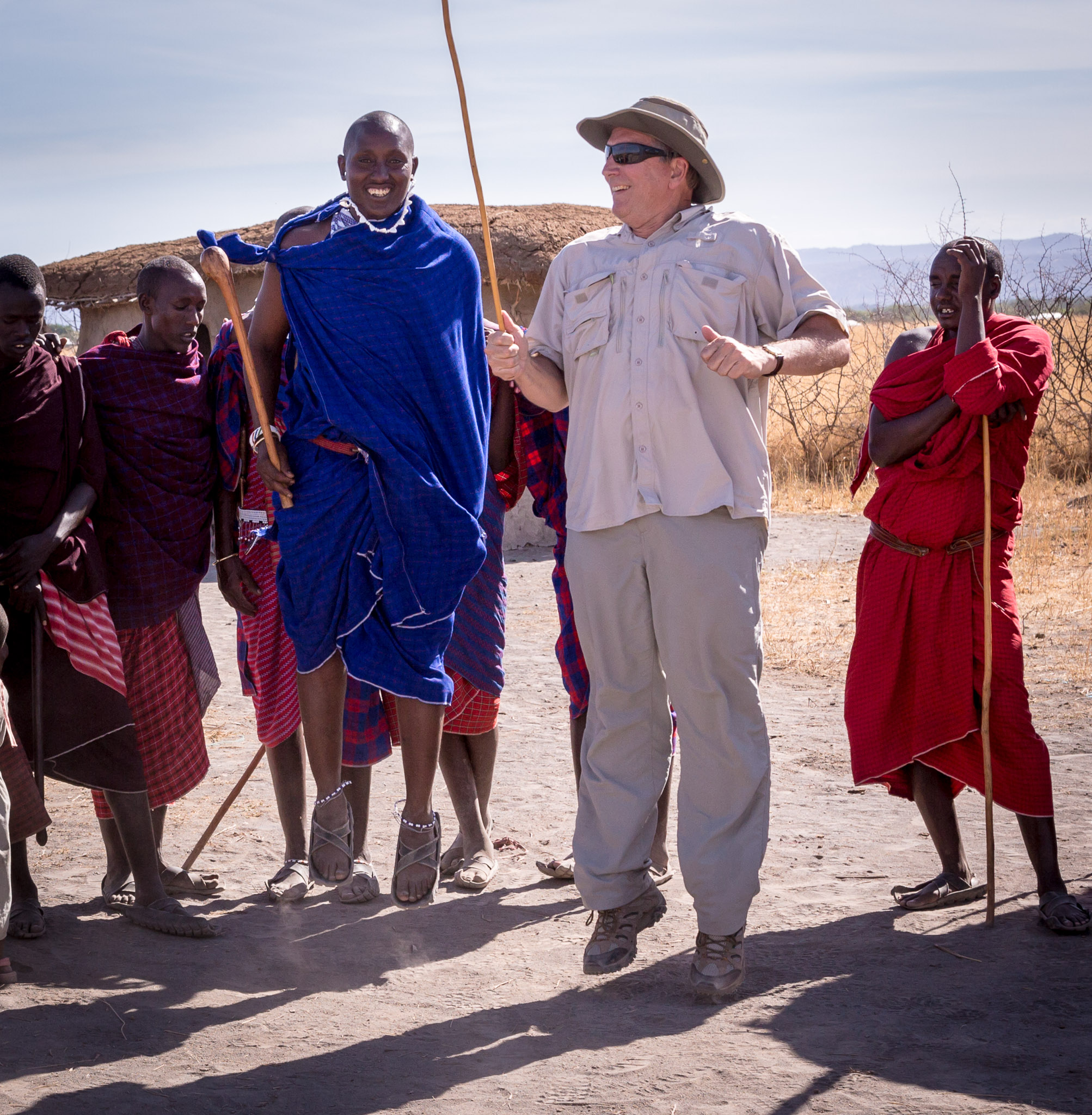 Non-Maasai manperforming iconic jump/dance