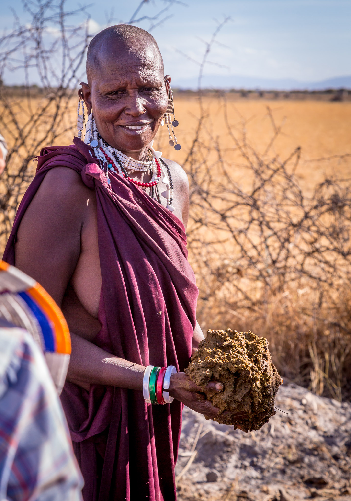 Learning how to surface Maasai hut with dung & mud