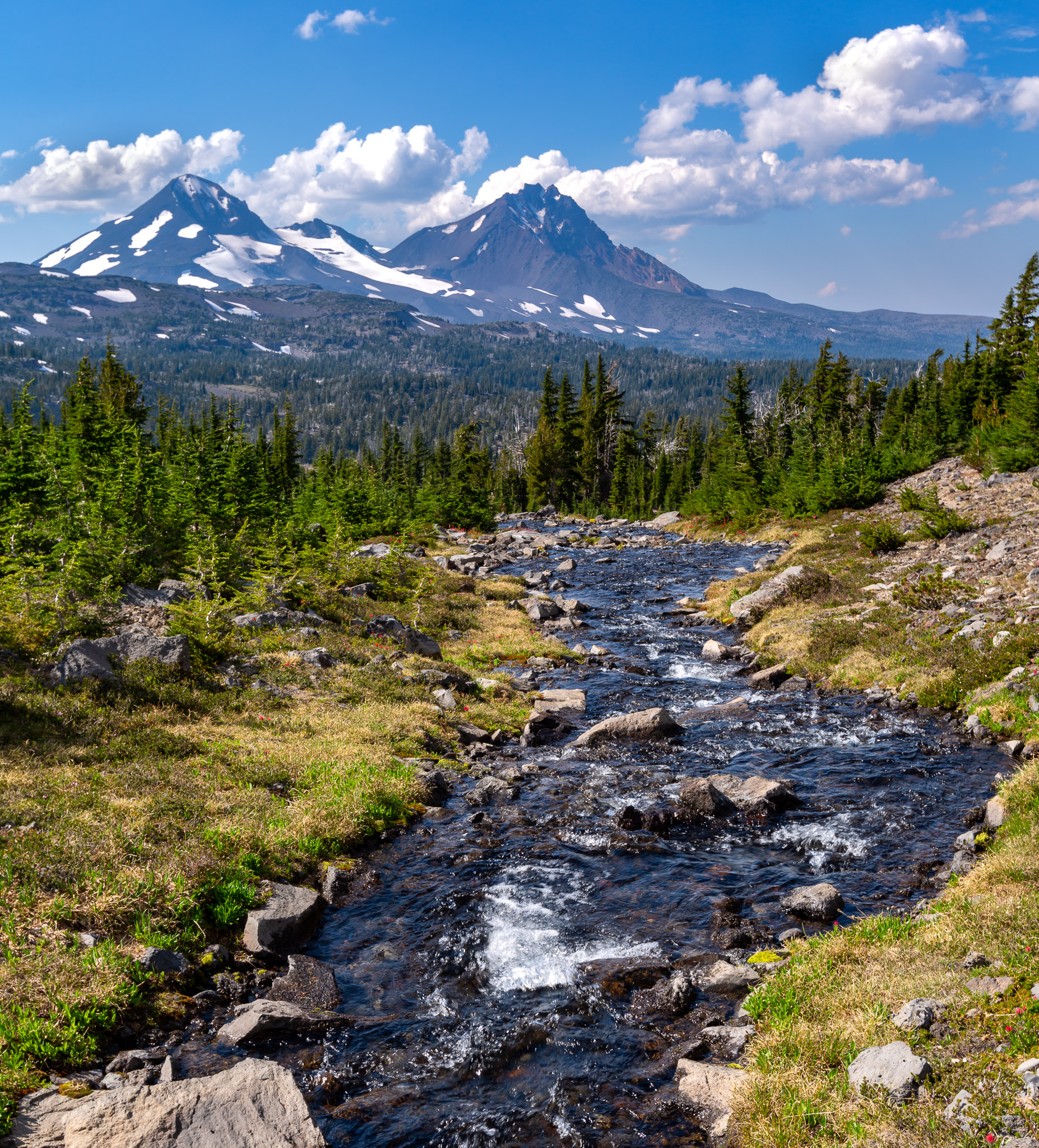 Stream above Golden Lake; Middle & North Sister in distance