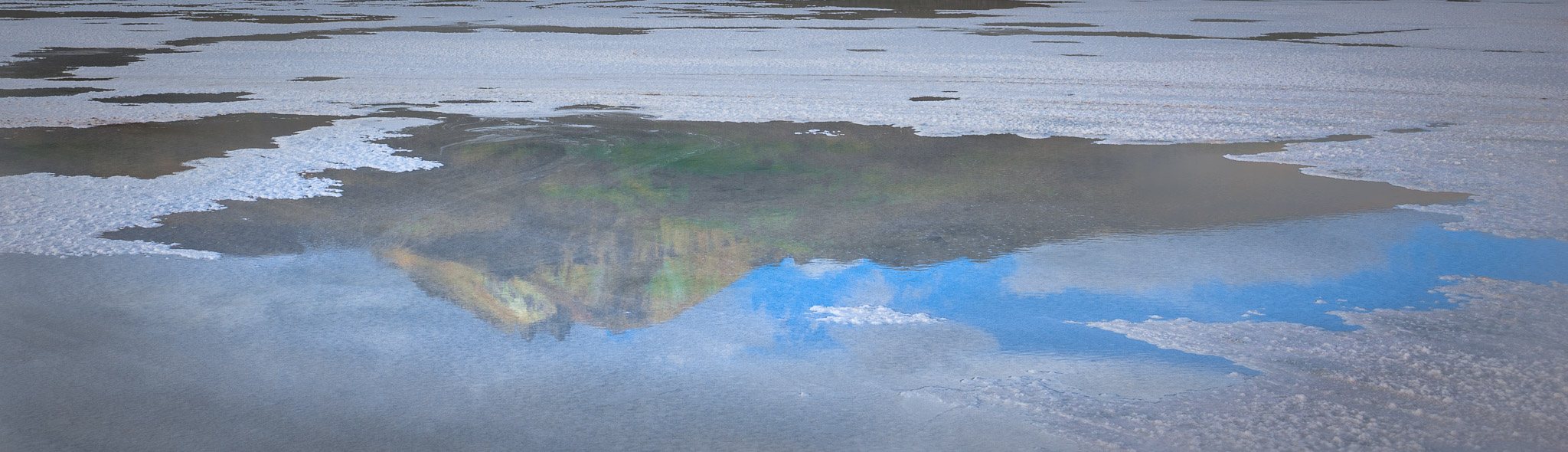 Volcan Tunupa reflected in Salar de Uyuni