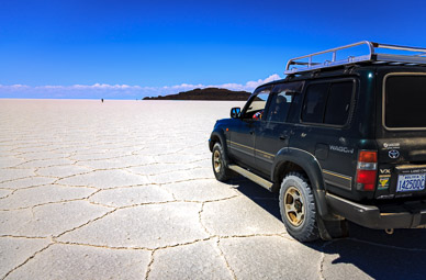 Martha walking to Isla Incahuasi & Paulino following, Salar de Uyuni