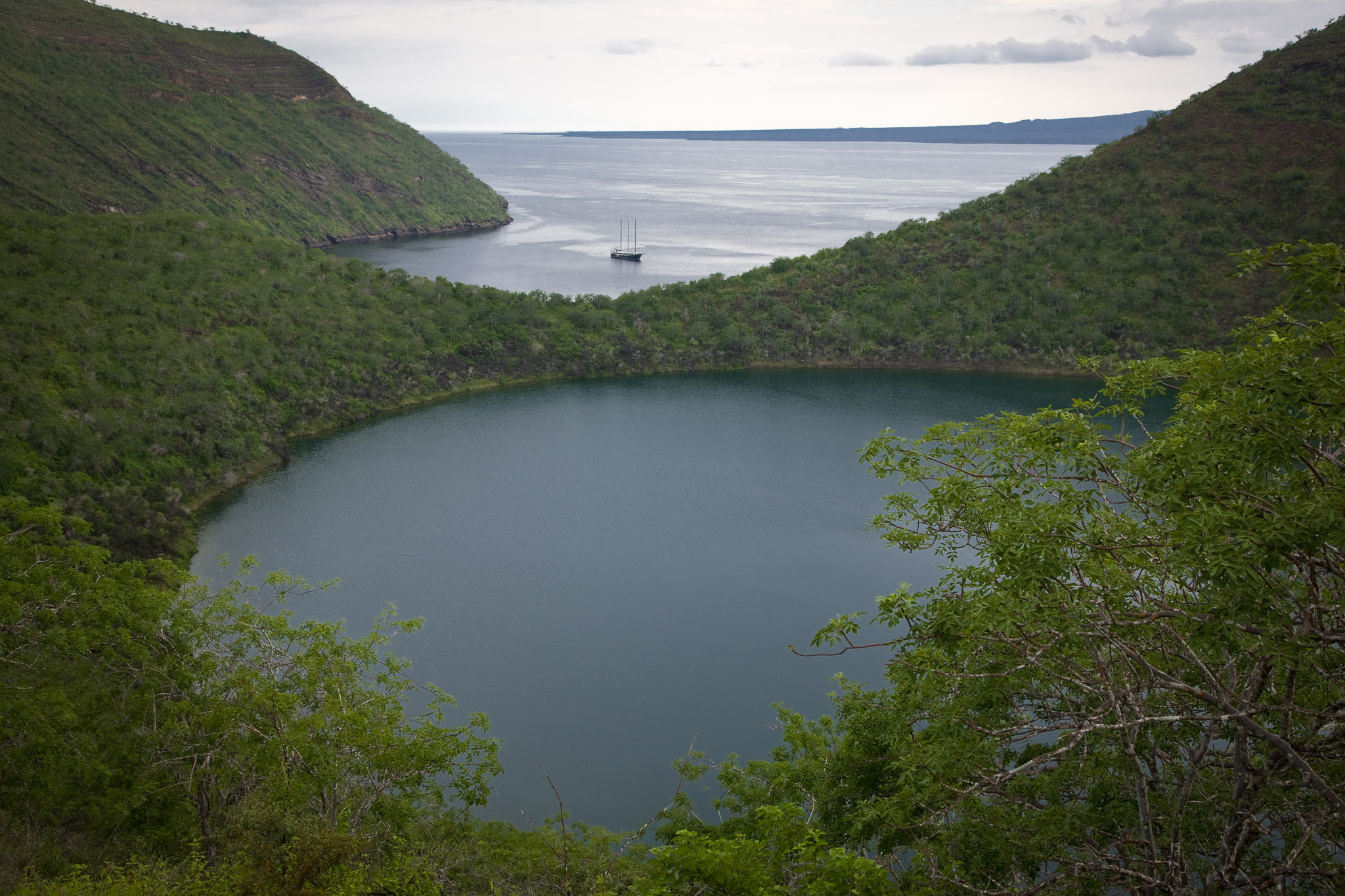 The Alta anchored in Tagus Cove, Darwin lake in the foreground (Isla Isbella)