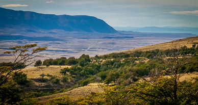 View east across Argentinean steppes, Lago Viedma & road into El Chalten in distance