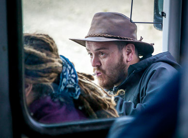 Alex drinking maté with bus driver