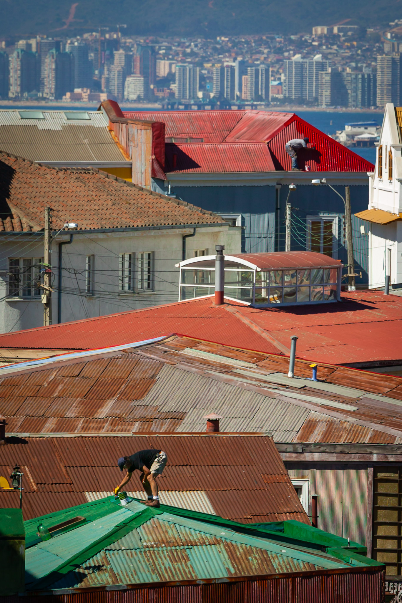 Two roofs being painted