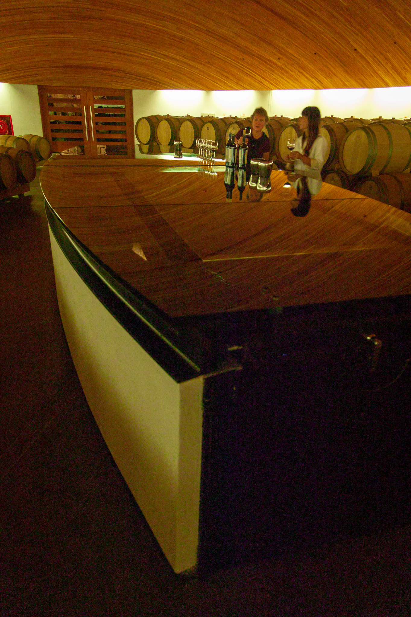 Under elipical glass table is staircase to lower private wine cellar (2 levels) at Clos Apalta