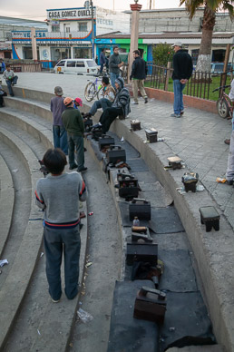 Shoe shiners waiting for church goers