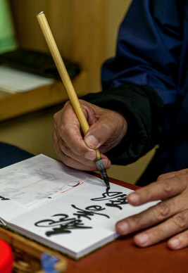 Inscribing souvenir "passport" books