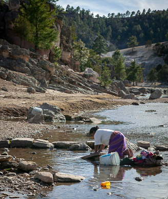 Doing laundry in Cusárare River at Sierra Lodge