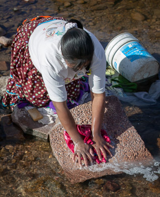 Doing laundry in Cusárare River at Sierra Lodge