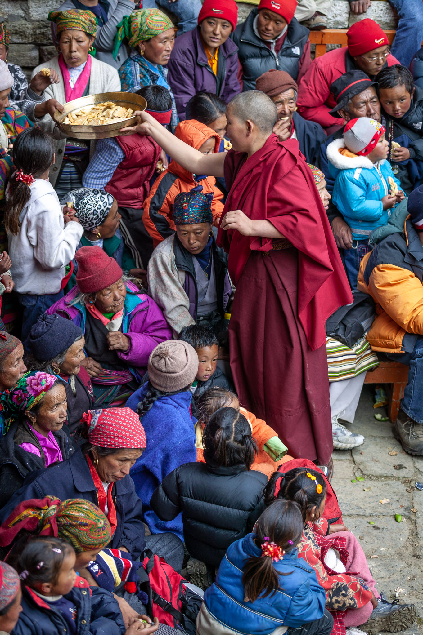 Buddhist nun giving refreshments