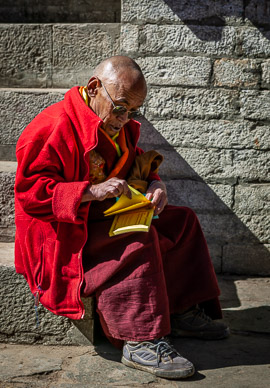 Tengboche Monastery monk selling tickets for Mani-Rimdu Festival